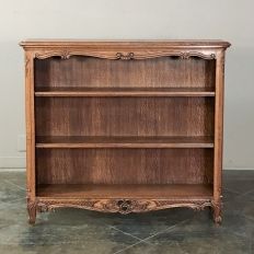 an old wooden bookcase with two shelves