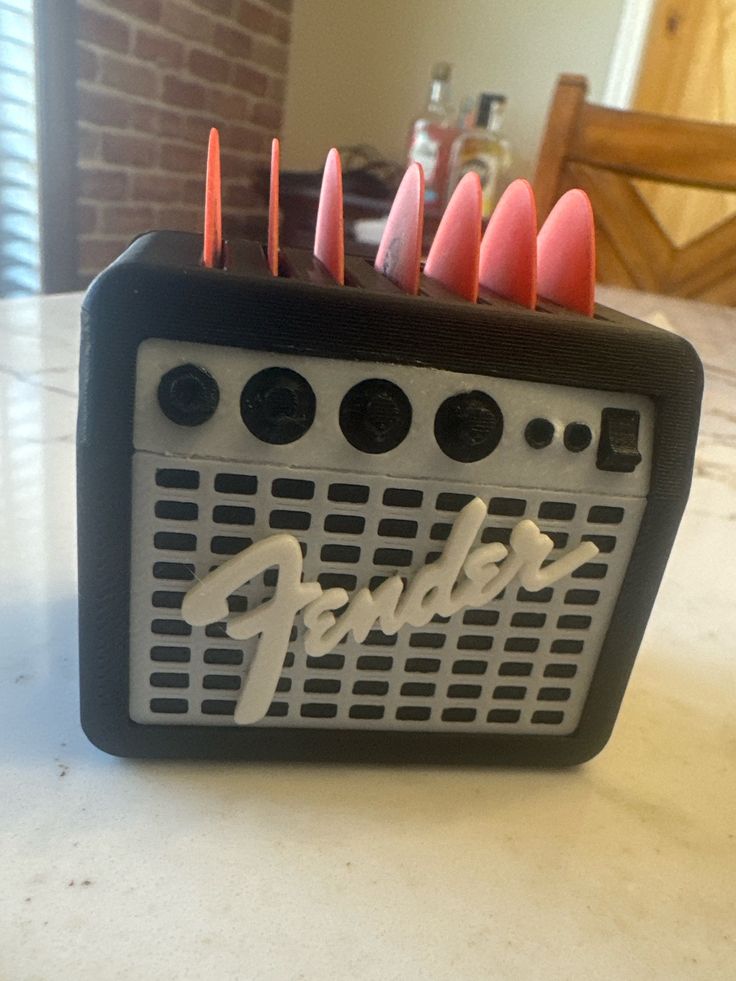 a black and white radio sitting on top of a table