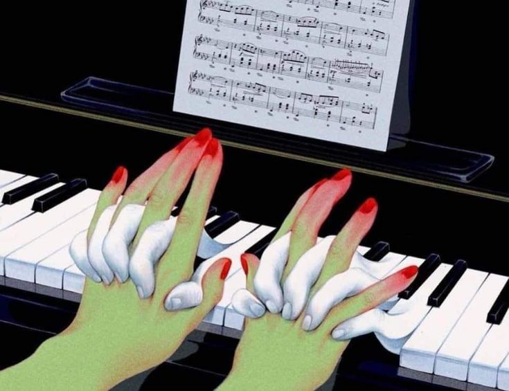 two hands with red fingernails are playing the piano