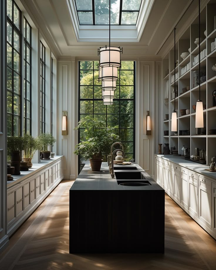 a large kitchen with lots of windows and cabinets