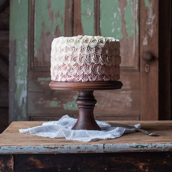 a white cake sitting on top of a wooden table