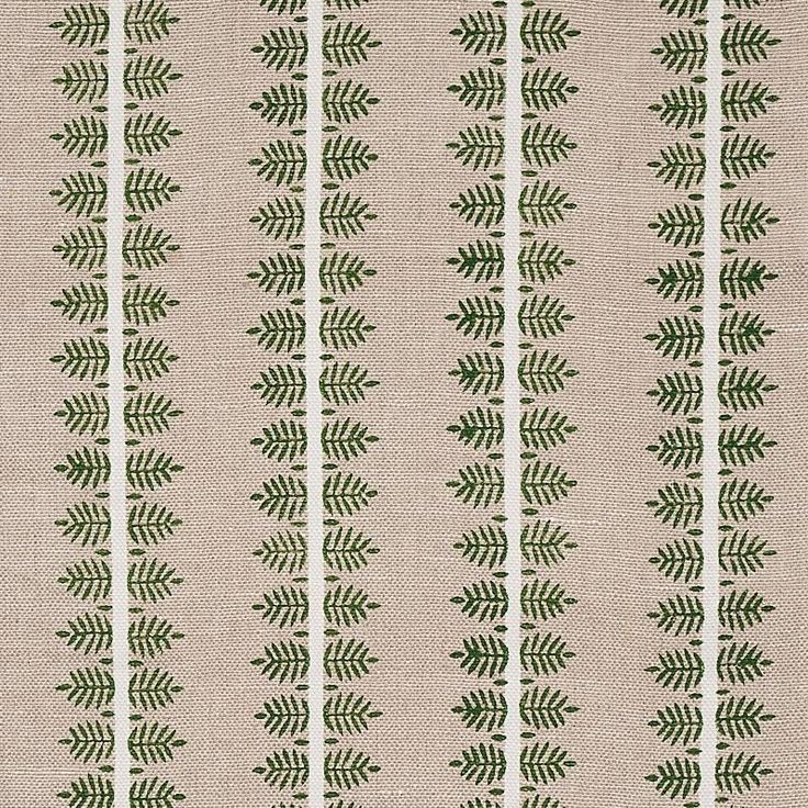 a beige and green patterned fabric with small leaves on the side, in rows of vertical stripes