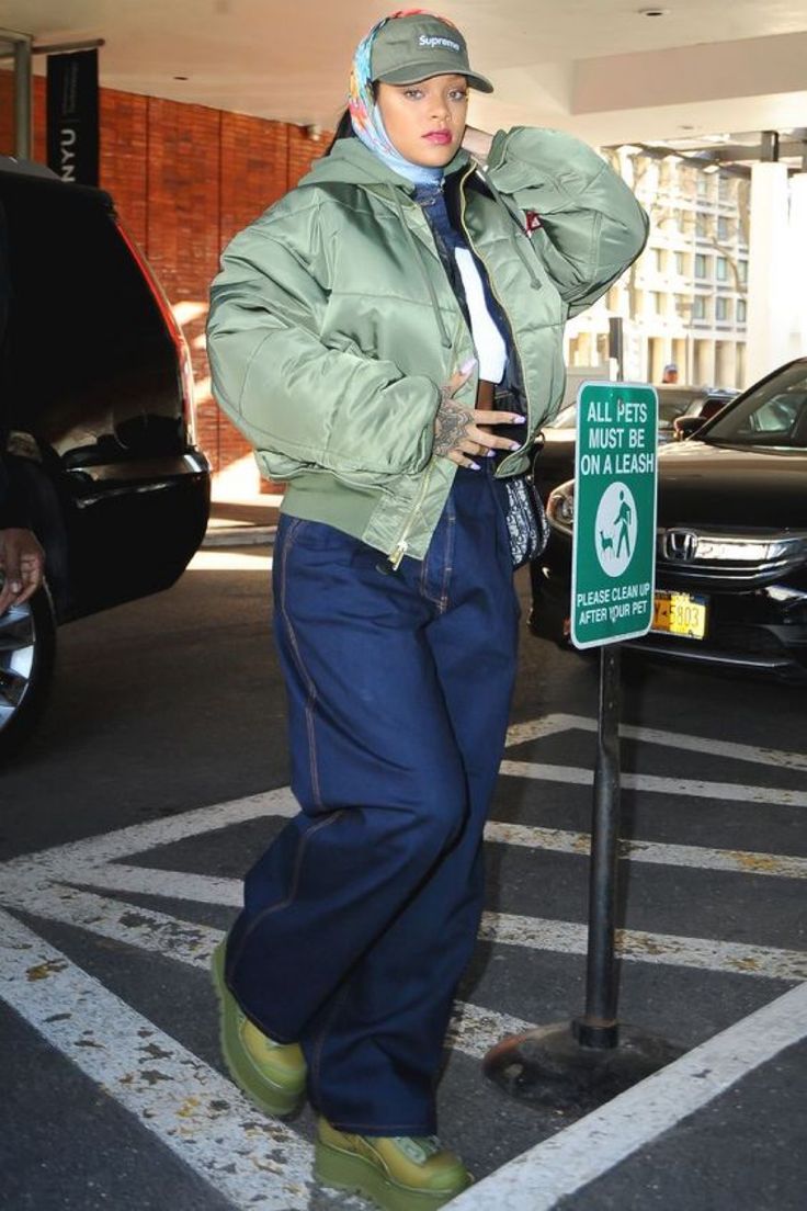 a man standing next to a parking meter