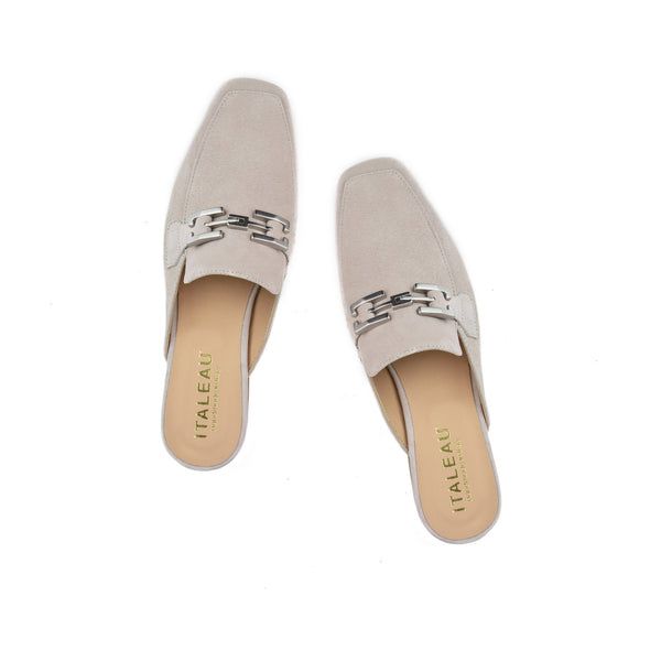 Cecile Mules | Women’s Mules | Italian Suede Shoes - Italeau Chic Beige Almond Toe Slip-ons, Spring Business Casual Flat Slip-ons, Spring Office Slip-on Mules, Spring Business Casual Slip-ons, Beige Slip-on Mules For Spring, Trendy Flat Heel Slip-ons For Work, Formal Beige Slip-ons For Spring, Elegant Spring Clogs With Leather Sole, Summer Slip-on Office Loafers