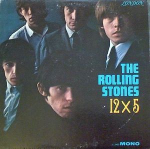 the rolling stones album cover with four men in suits and ties, one is wearing a blue shirt