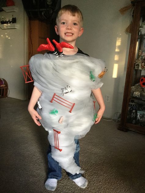 a young boy is dressed up as a ghost