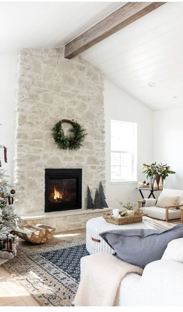 a living room with a christmas tree in the corner and an instagram page below