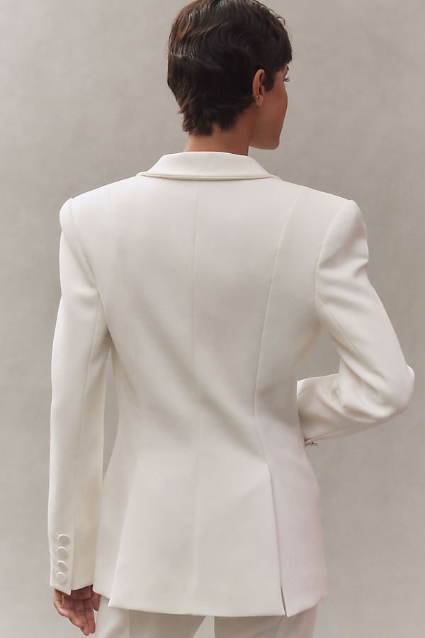 Featuring a flattering tapered waist, the expertly tailored Sloan Structured Blazer features ultra-structured shoulder pads and a plunging neckline, exuding sleek style and undeniable allure. | Sloan Structured Blazer Jacket by SANS FAFF in White, Women's, Size: Smallmall, Polyester/Viscose/Glass at Anthropologie Elegant V-neck Blazer For Semi-formal Occasions, Elegant V-neck Semi-formal Blazer, Elegant Fitted V-neck Outerwear, Sleek Formal Blazer With Concealed Front Fastening, Sleek Structured Blazer For Semi-formal Occasions, Chic Evening Blazer With Lapel Collar, Tailored V-neck Formal Outerwear, Fitted V-neck Blazer With Hidden Button Closure, Fitted V-neck Blazer With Hidden Buttons