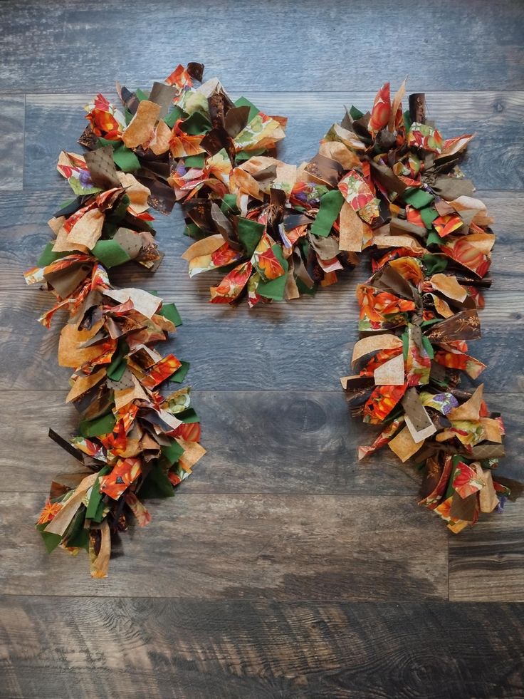 a number of pieces of paper on top of a wooden floor