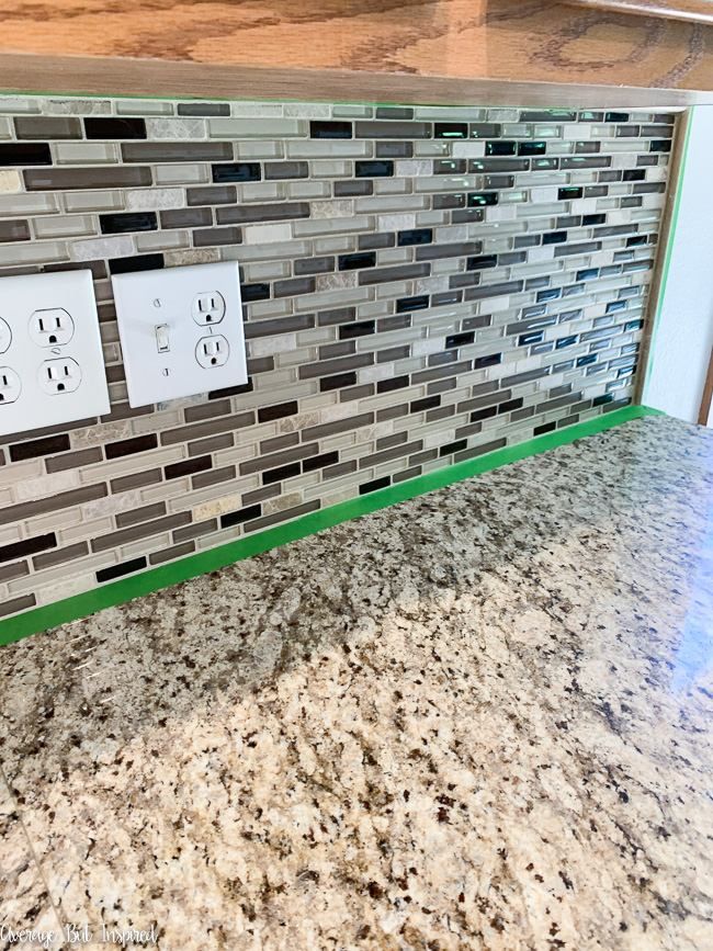 the kitchen counter is clean and ready to be used as a tile backsplash