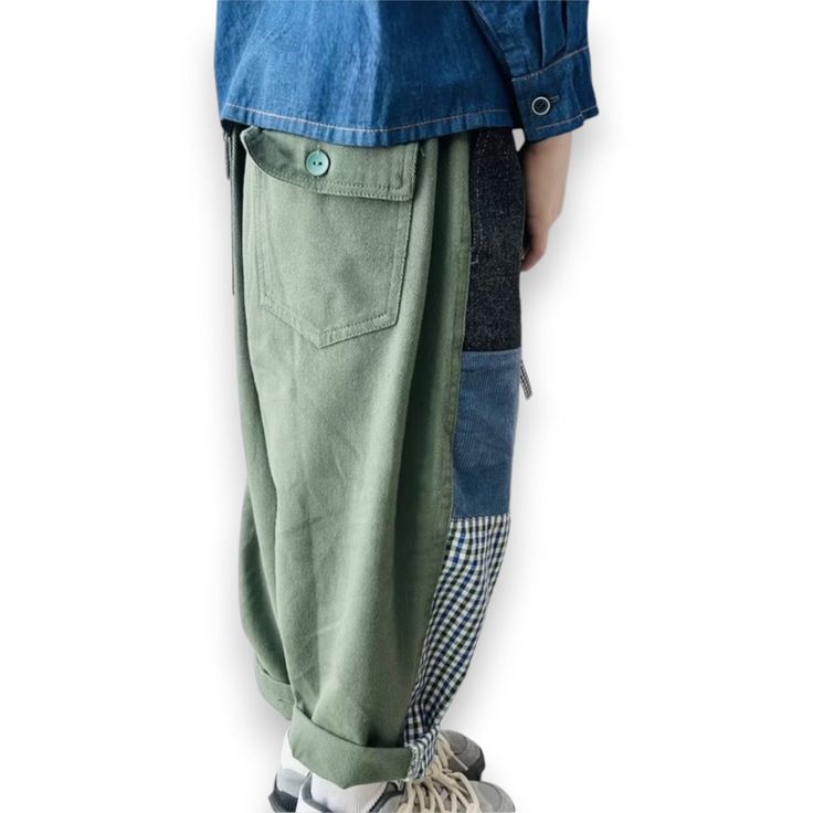 The Patchwork Pant is the perfect mix of bold style and comfy, casual vibes. This unisex pant features a supercool patchwork design on the front and soft army green cotton on the back, complete with two back pockets and button closures for extra flair. With a baggy, relaxed fit, these pants are easy to dress up or down and look amazing cuffed with a peek-a-boo fun sock. Made from 100% cotton, they’re breathable and perfect for all-day wear. Patchwork design on the front for standout style Soft army green cotton back for ultimate comfort Two back pockets with button closures for added functionality Baggy fit that’s perfect for any occasion Looks great cuffed with a fun sock for extra style Made from 100% cotton for breathable, all-day comfort The Patchwork Pant is your go-to for a cool, eff Khaki Cotton Cargo Pants, Green Streetwear Bottoms With Patch Pockets, Khaki Cotton Parachute Pants With Pockets, Green Bottoms With Patch Pockets For Streetwear, Cotton Harem Pants For Fall, Baggy Cotton Utility Harem Pants, Casual Wide Leg Patchwork Pants, Utility Cotton Cargo Style Harem Pants, Baggy Cotton Cargo Pants With Patch Pockets