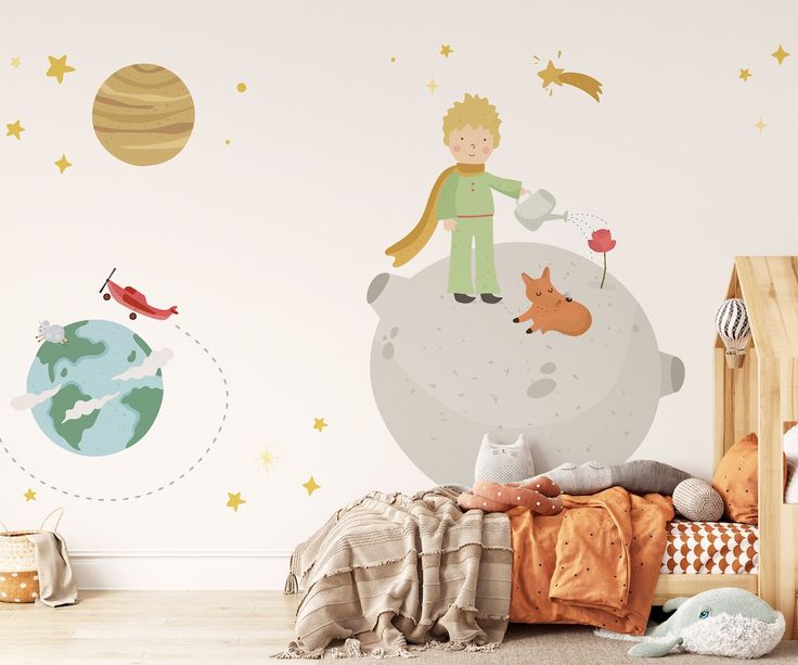 a child's bedroom with a wall decal featuring an astronaut and his dog