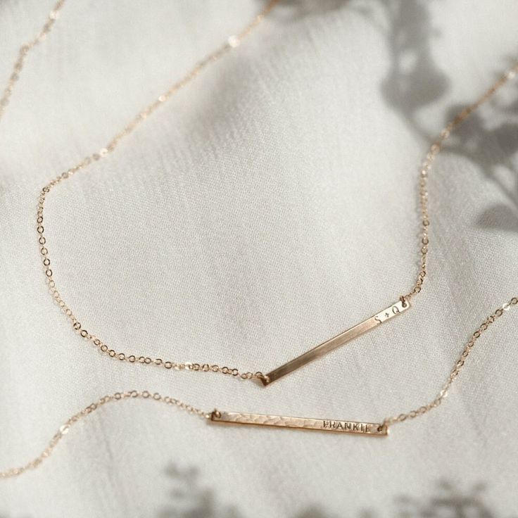 "The daintiest personalized necklace you'll ever meet--like a secret just for you! Perfect for teeny initials or other mini inscriptions you want to keep close. For those of you who prefer it subtle, this baby's for you.   Every piece is handcrafted and hand-personalized with love in La Conner, WA, using 90% recycled and 100% ethically sourced raw materials from the USA--because it's better that way. Includes free gift-ready packaging (featuring a care card and traditional letterpress goodies made by my dad)!  This piece is too small for coordinates; for a custom coordinates piece, please see: https://www.etsy.com/listing/289990687/ MATERIALS: * Gold = 14k gold filled * Silver = sterling silver * Rose gold = 14k rose gold filled DETAILS: * 30x2mm bar * Hand-personalized with traditional me Everyday Rose Gold Name Necklace With Adjustable Chain, Personalized 14k Gold Filled Necklaces For Wedding, Minimalist 14k Gold Filled Necklace For Personalized Gift, Personalized 14k Gold-filled Necklaces For Wedding, Minimalist Personalized Necklaces For Everyday, Rose Gold Name Necklace With Delicate Chain For Anniversary, Minimalist Engraved 14k Gold Filled Necklaces, Minimalist Rose Gold Necklace For Personalized Gift, Minimalist Personalized 14k Gold Filled Necklace