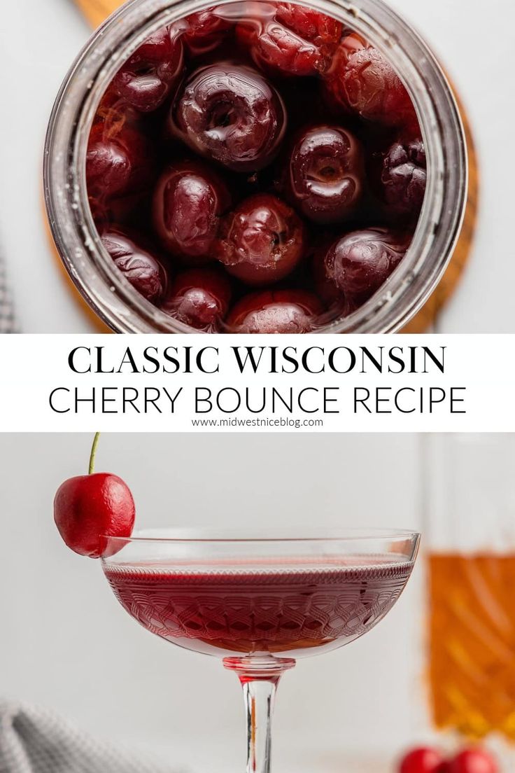 a glass filled with cherries sitting on top of a table