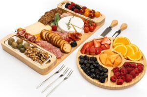 two wooden trays filled with different types of food and utensils next to each other