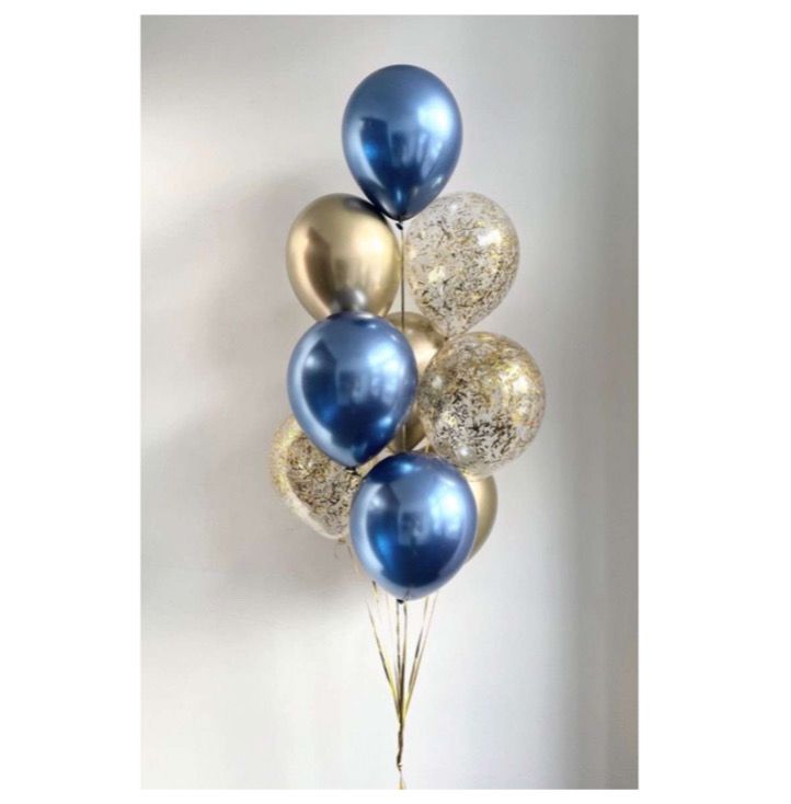 blue and gold balloons are in the air