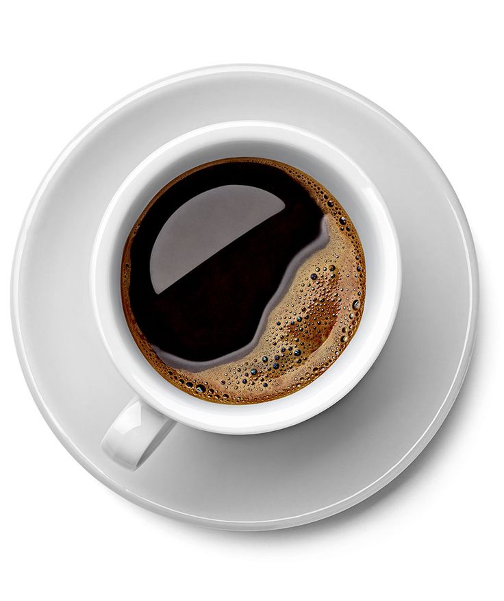 an overhead view of a cup of coffee on a saucer