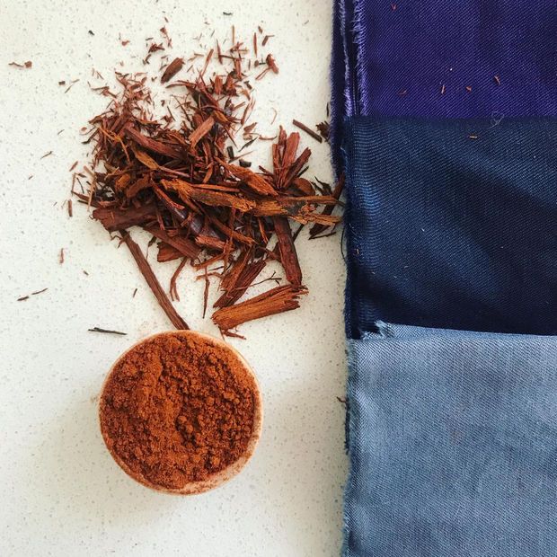 a pile of brown powder next to a blue cloth