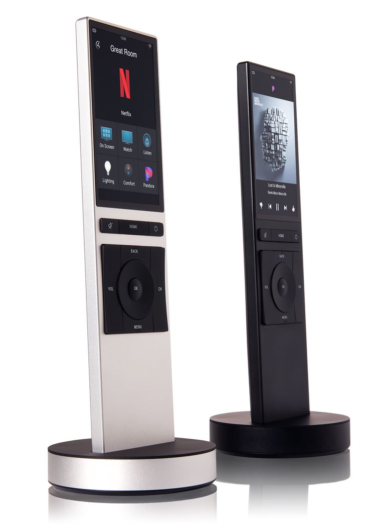 an mp3 player is sitting on top of a stand with the remote in front of it