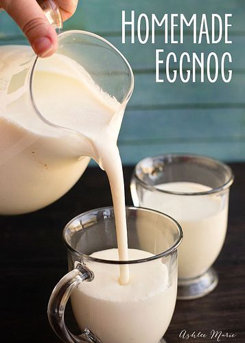 milk being poured into two glasses on a table