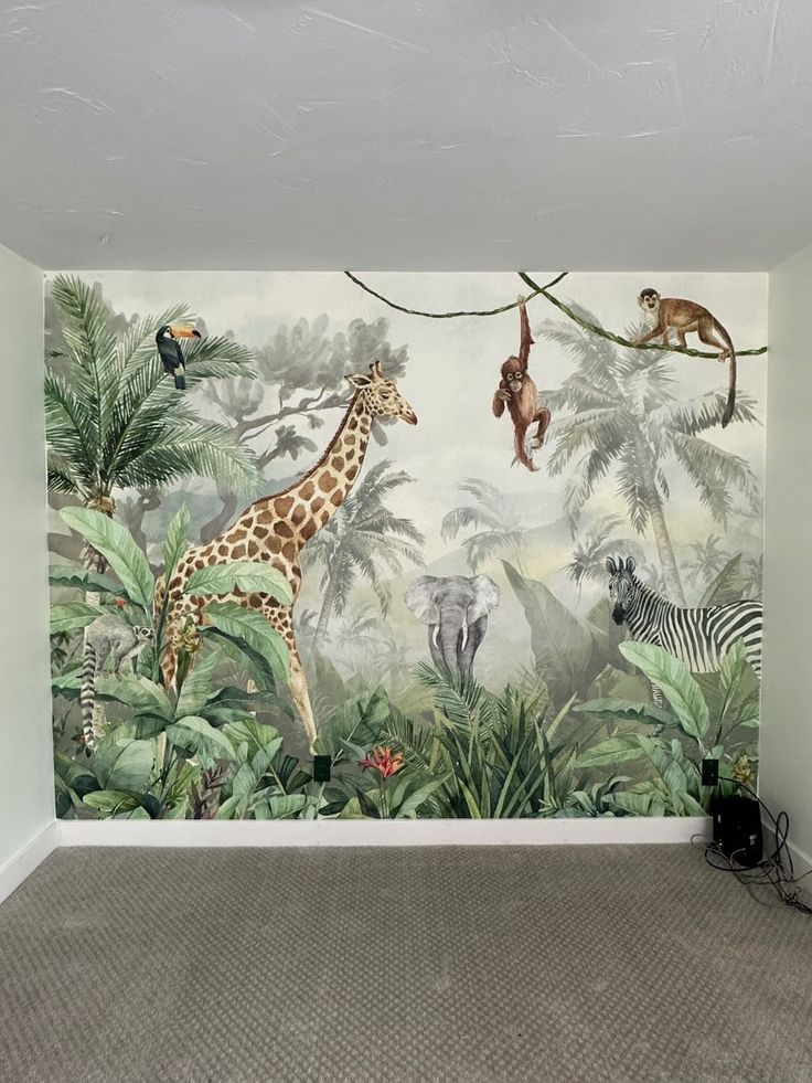 a wall mural with animals and trees in the background is painted on an empty room