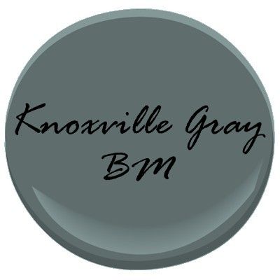 a gray button with the words knoavillee gay bm on it