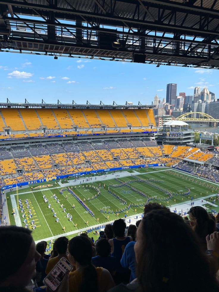 a stadium filled with people watching a football game