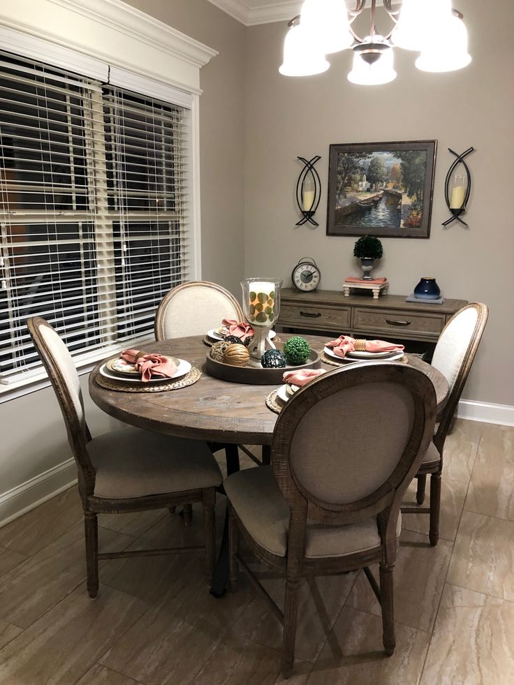 the dining room table is set for four