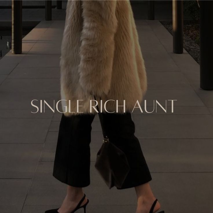 a woman in high heels is walking down the street wearing a fur coat and black pants