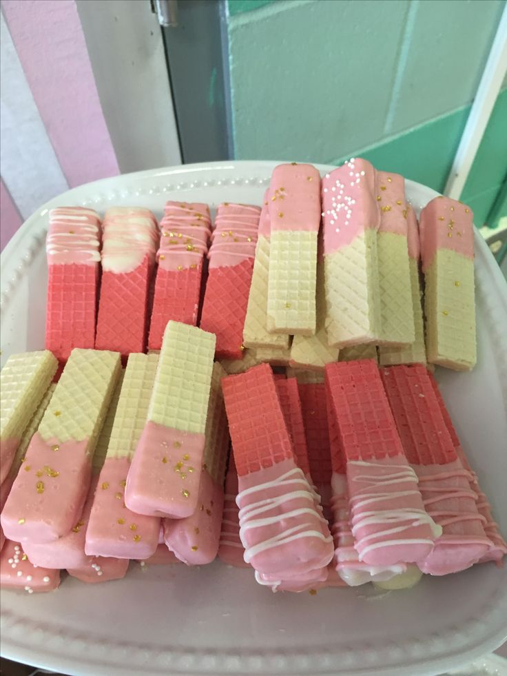 pink and yellow marshmallows on a white plate