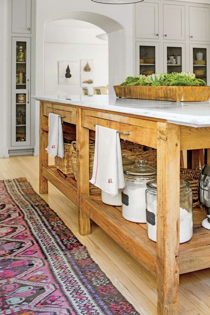 a large kitchen island with lots of food on it