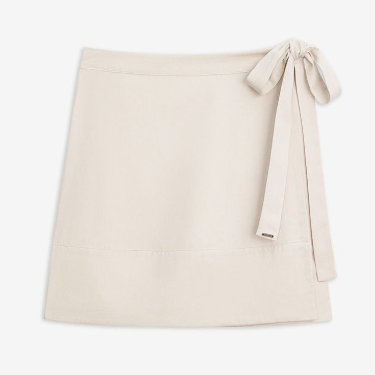 A classic reimagined– our lived-in midi-length Wrap Skirt is chic, comfortable, and easy to throw on. Made from our unique blend of tencil and linen, the fabric is lightweight, breathable, and oh-so-soft. Featuring an always-flattering fit and adjustable tie, making our skirt a versatile all-season staple.DETAILS:Recycled PET logo charm 88% Tencel, 12% Linen Adjustable waist tie Chic Relaxed Wrap Skirt For Fall, Spring Viscose Skirt, Summer Viscose Skirt For Day Out, Neutral Fitted Skirt For Summer, Beige Relaxed Fit Skirt For Spring, Fitted Neutral Skirt For Summer, Summer Rayon Relaxed Skirt, Summer Rayon Skirt With Relaxed Fit, Summer Flared Skirt In Viscose