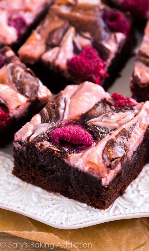 chocolate raspberry brownies on a white plate