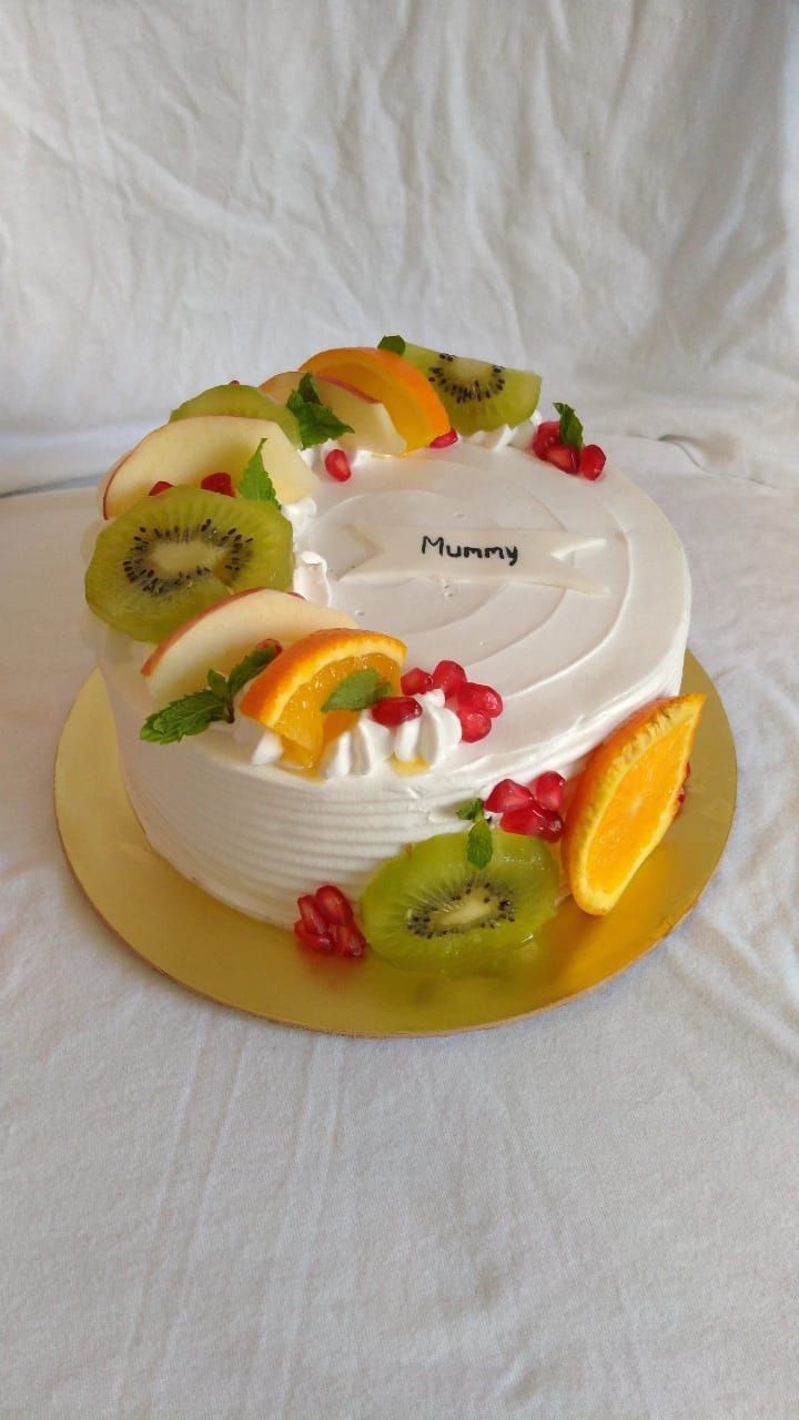 there is a cake that has fruit on it