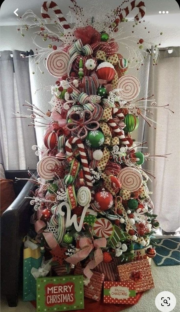 a christmas tree decorated with candy canes and candies