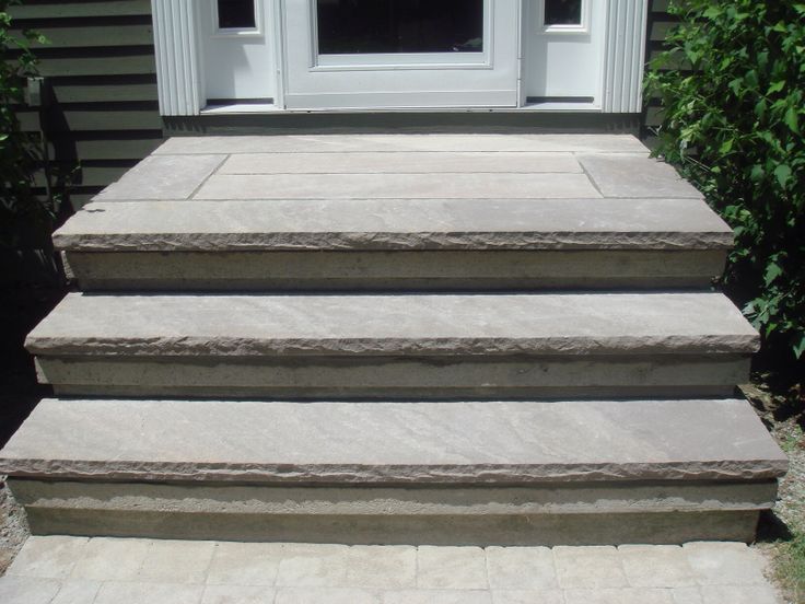 steps leading up to the front door of a house