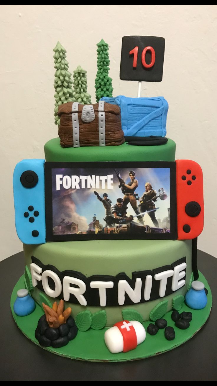 a cake made to look like a fortnite video game console with the words fortnite on it