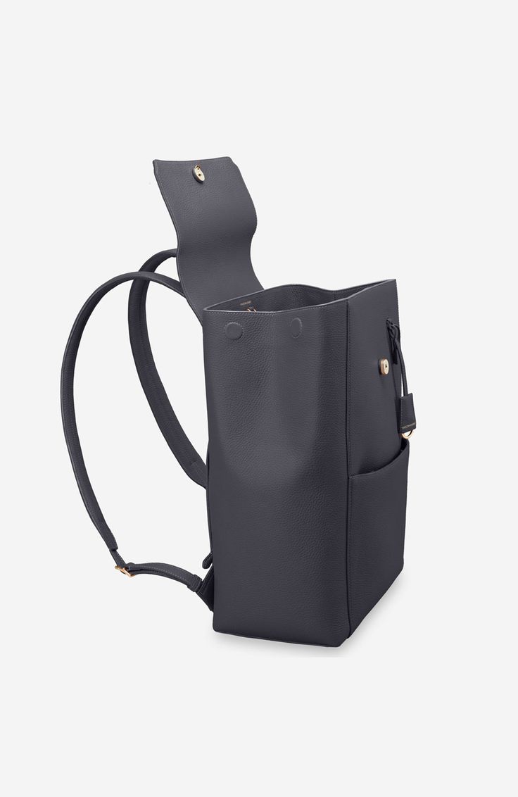 A chic and ultra-spacious office companion to refine your work-from-anywhere style. The Large Soft Backpack, handcrafted entirely from full-grain European leather, reimagines The Mini Soft Backpack with enhanced storage capability and increased all-day comfort. Featuring magnetic closure, a padded laptop sleeve to secure devices up to 16" and priority and zipped pockets to house valuables, the elegant carryall caters to every professional need. Crafted entirely from full grain sustainable DriTan Elegant Leather Satchel Backpack For Work, Modern Leather Backpack With Leather Lining For Everyday, Modern Backpack With Leather Lining For Everyday, Chic Leather Workwear Backpack, Elegant Leather Backpack With Detachable Strap, Leather Workwear Backpack, Chic Standard Backpack For Work, Classic Backpack With Smooth Grain For Everyday Use, Versatile Rectangular Backpack With Leather Lining