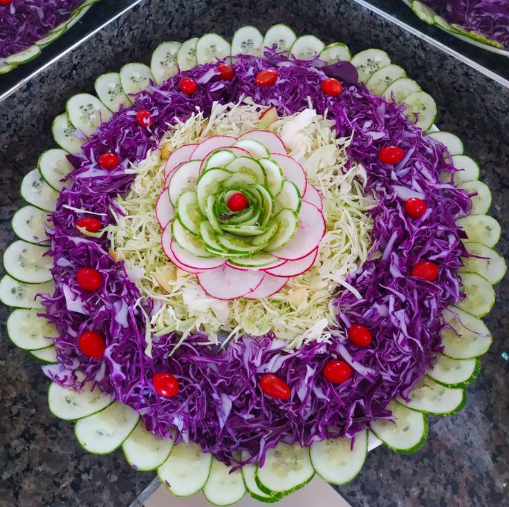 an arrangement of veggies arranged in the shape of a flower on a platter