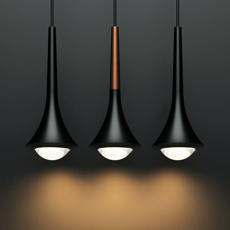 three black lamps hanging from the ceiling with dim lights on each one and two different shades