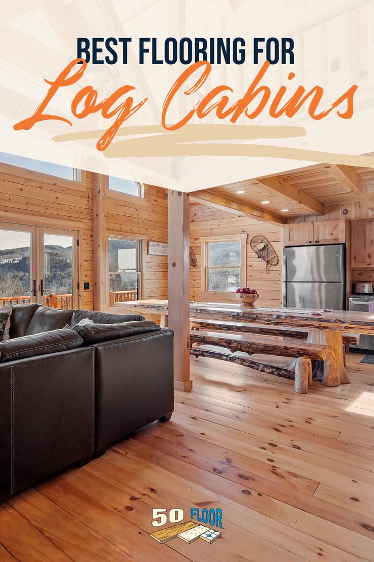 a living room filled with furniture next to a kitchen and dining area in a log cabin