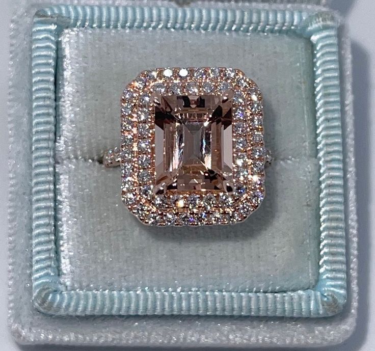 an engagement ring in a box with diamonds