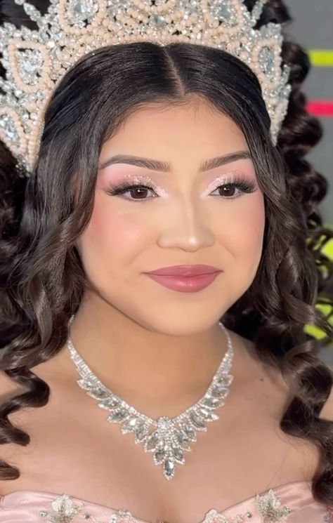 a woman wearing a tiara and necklace