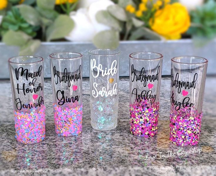 the bride and groom shot glasses are decorated with confetti, sprinkles, and glitter