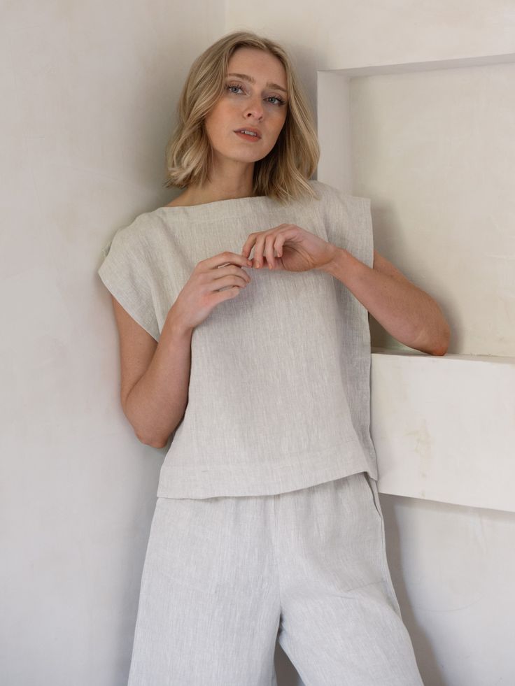 Our iconic Everyday Top is handcrafted from luxurious certified organic linen in new, Natural linen. This easy, minimalist top features a wide neckline, slightly boxy body, and mid-to-cropped length, perfect for tucking into our Everyday Crop Pant or wearing with your favorite jeans. We appreciate the natural beauty of linen's undyed color and are excited to highlight it this season in our new Natural colorway. This style will ship between 8/15 - 8/25. Made with Organic Linen Lined with Organic Relaxed Fit Natural Color Summer Tops, Chic Everyday Linen Tops, Relaxed Linen Tops For Daywear, Everyday Flax Tops For Spring, Everyday Neutral Linen Top, Summer Flax Tops For Daywear, Chic Linen Tops With Relaxed Fit, Casual Neutral Linen Tops, Chic Relaxed Fit Linen Tops