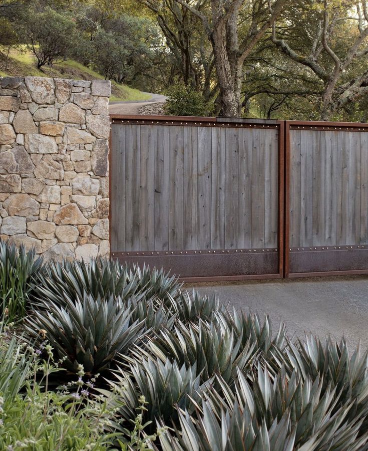 a couple of wooden gates sitting next to each other