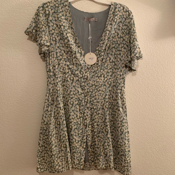 This Is The Cutest Dress Ever. Very Booby, But With An Undershirt, Or Smaller Chested Ladies, It Would Be Fantastic. Size 14 But This Is An Australian Size, So It Would Be Like A Size 10 In Us. Cute Fitted Button-up Dress, Casual V-neck Mini Dress For Garden Party, Casual Ditsy Floral Mini Dress For Garden Party, Ditsy Floral Print Sundress With Short Sleeves, Ditsy Floral Print Short Sleeve Sundress, Sundress With Ditsy Floral Print And Short Sleeves, Cute Floral Print Sundress With Short Sleeves, Cute Floral Short Sleeve Dress For Day Out, Cute Short Sleeve Floral Dress For Day Out