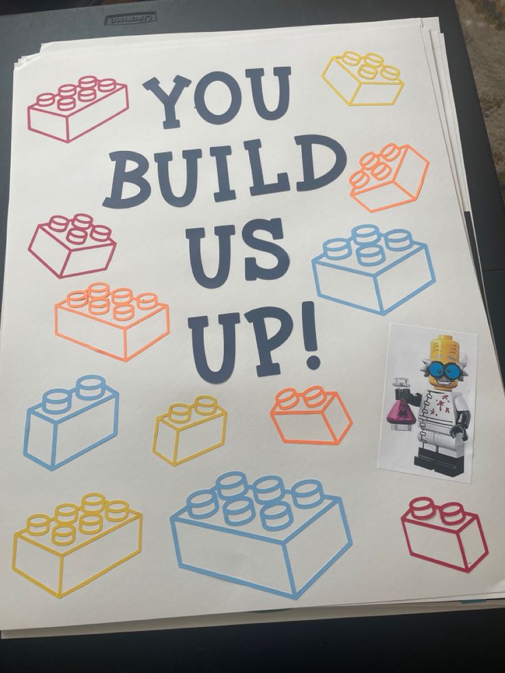 a sign that says you build us up with legos on it and the words, you build us up