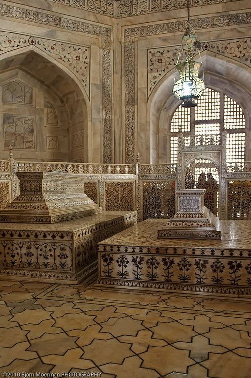 an intricately decorated room with stairs and windows