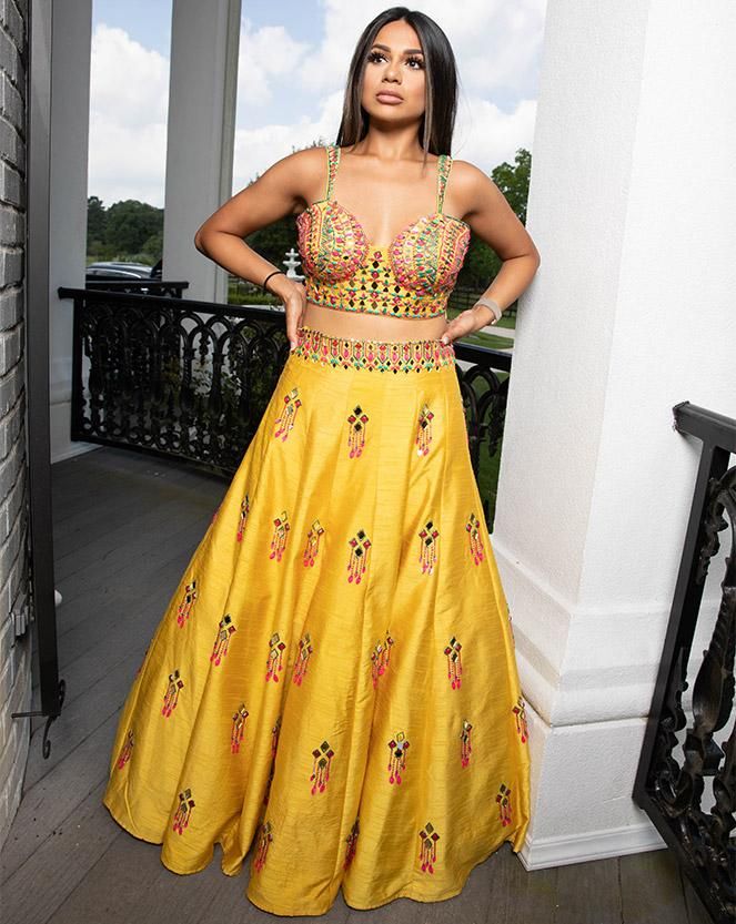 Make room for our one-of-a-kind vibrant lehenga that comes with everything a girl can imagine. Our perfectly sculpted bustier is matched effortlessly with the yellow skirt. The intricate, geometric embroidery and wonderful play of colors make this lehenga a great choice no matter what the occasion! DELIVERY TIMEPlease allow 4-6 months for your outfit to arrive. FABRIC DETAILSSilk. Professional cleaning only. Yellow Embellished Designer Wear Sets, Designer Yellow Embellished Sets, Yellow Embellished Sharara For Navratri, Yellow Embellished Dress For Navratri, Embellished Yellow Dress For Navratri, Embellished Yellow Sets For Reception, Embellished Yellow Sharara For Diwali, Diwali Yellow Embellished Sharara, Embellished Floor-length Lehenga With Fitted Bodice